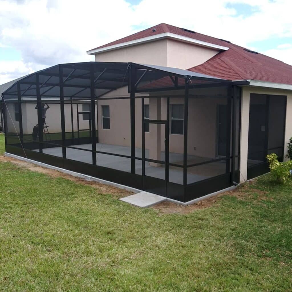 Patio enclosure installation in Titusville, FL attached to residential backyard home